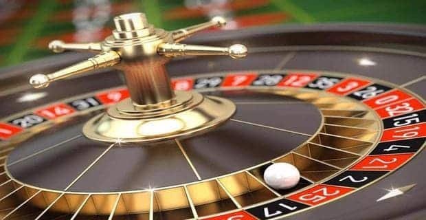 Mobile phone showing 777 jilibet slot game reels in play